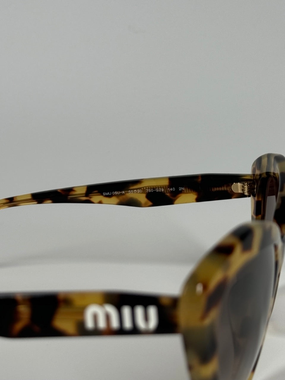 MIU MIU CAT-EYE TORTOISE SUNGLASSES